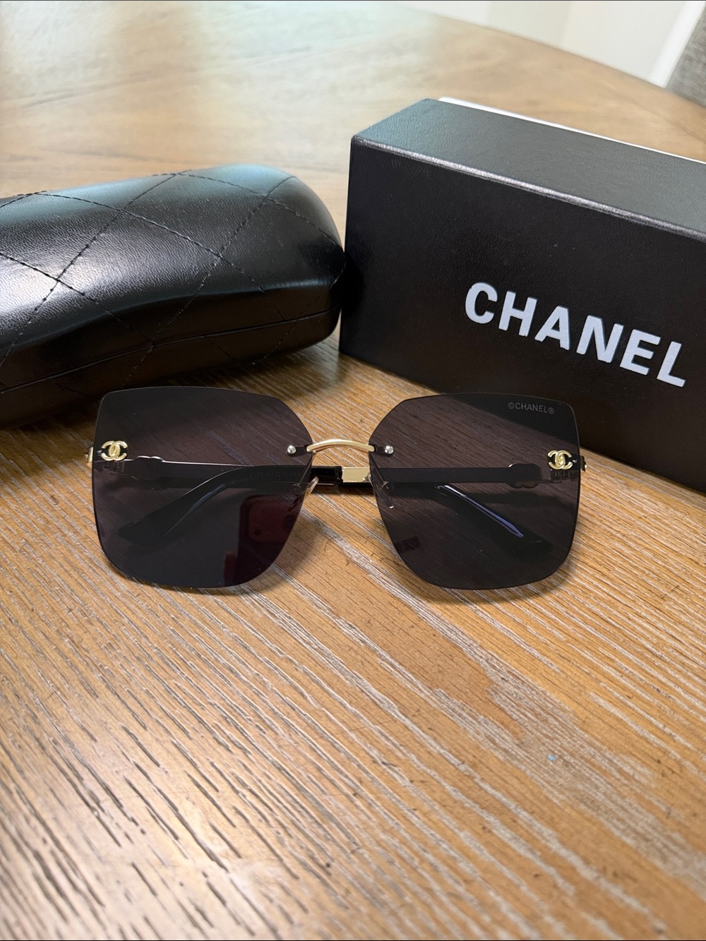CHANEL Rimless Square Sunglasses with Dark Gradient Lenses and Gold Accents